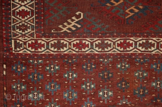 Yomud "Dyrnak" main carpet, 310x170 cm, 19th cent., fantastic colors, different blues , greens, yellows.... unusual elem, opened, bold and graphic drawing, well balanced, spacious field, very fine weave, some unfolded part  ...