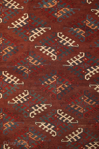 Yomud "Dyrnak" main carpet, 310x170 cm, 19th cent., fantastic colors, different blues , greens, yellows.... unusual elem, opened, bold and graphic drawing, well balanced, spacious field, very fine weave, some unfolded part  ...