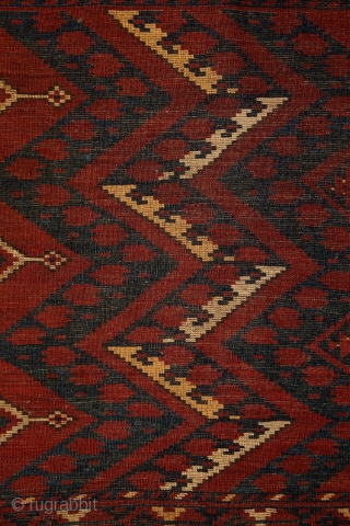 Ersari 'ikat' chuval, 19th century, 150x100 cm, almost intact condition, some small wear in the upper end otherwise full, meaty pile overall. 3 floating cross-medallions in a tremolous, deep field. Clear, archaic  ...