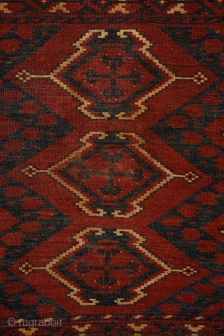 Ersari 'ikat' chuval, 19th century, 150x100 cm, almost intact condition, some small wear in the upper end otherwise full, meaty pile overall. 3 floating cross-medallions in a tremolous, deep field. Clear, archaic  ...