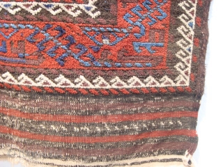 Late 19th century Baluch Mina Khani rug with full pile and kilims, but, with corrosion to browns/black.  Two blues,  aubergine/brown, red, natural white and a couple of yellow flecks in  ...