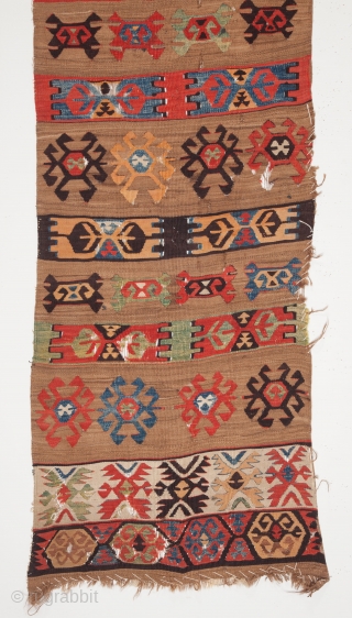 Anatolian kilim fragment circa 19th century, extensive use of camel wool, vibrant natural colours, various losses and damage as apparent in the images, securing done for washing still in place, 366 x  ...