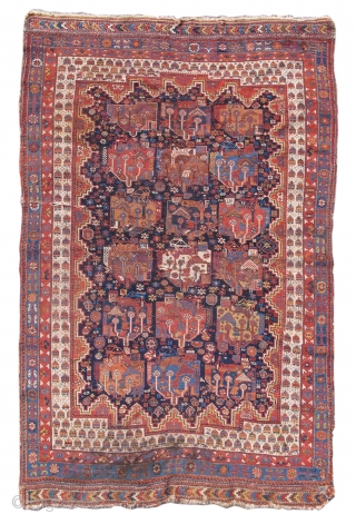 Woven with a deep indigo ground and playful border, this Afshar rug displays a repeat design of abstract floral clusters. Collectors of south Persian tribal weaving sometimes refer to this design as  ...