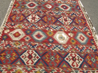 Shirvan Kilim, good age, colorful and graphic with a particularly good use of white.

This piece is lightly mounted and conserved against a white cloth.
size is 5'10"x8'0"       