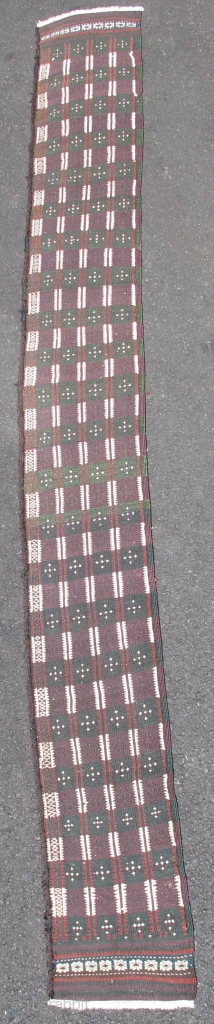 Baluch Flatwoven Trapping, southwestern Pakistan, early 20th century.
A minority of Baluch weavings can actually be attributed to Balochistan proper. This long trapping woven finely with floating weft technique is expertly dyed with  ...