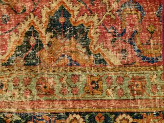 Border Fragment of a 17th century Isfahan or Indo-Isfahan Carpet. This fragment preserves a small portion of the red lac ground with a blue cloudband and floral ornament. A larger portion of  ...