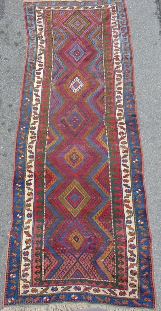 Jaf Kurd long rug with fiery red diamond field and bold minor borders. Size = 3'8" x 10'4" . Inv. # 14832.           