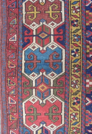 Northwest Persian Kurdish long rug with a very graphic geometric border and floral field. Size = 3'6" x 10'3". Inv. # 14834.           