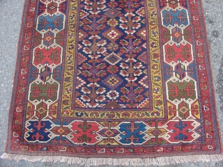 Northwest Persian Kurdish long rug with a very graphic geometric border and floral field. Size = 3'6" x 10'3". Inv. # 14834.           