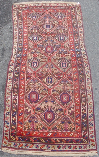 Northwest Persian Kurdish long rug with classic geometricized floral design. Very colorful and without fading, though there is a bit of fuchsine. circa 1900. A great useable floor rug. Later but still  ...