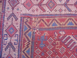 Kurd Rug, probably from Khorosan. Great wool and color with a regional adaptation of some familiar Kurdish drawing. Second Half of the 19th century (probably 3rd quarter). This piece has been cut  ...