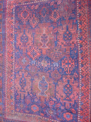 Timuri type Baluch carpet. Squarish proportions, 6'2" x 7'4", with the classic colors of this group including polychromatic blue. Harshang border and pen-box / flame palmette field with several animals woven in  ...