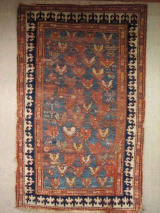 

An old Kazak with an unusual allover design usually associated with the east Caucasus and a beautiful field color. Pleasing to look at even with all its "issues". 122x208cm (4'x6'10")   