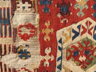 Uncommon, small-format kilim from west Anatolia. Possibly Kutahya area. Displays some features found on Yuncu heybes. The quality of the dyes indicate good age, pre-1850, in my opinion. A happy piece with  ...
