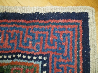 A "Wangdan", 19th century Tibet little rug.  Size is 27 X 42 inches. Perfect condition and unusual weave - see shot or reverse.         