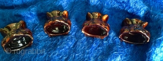 A very rare 19thC set of four glazed Redware Window Stops or Furniture Lifts in the form of Classical Stylized Claw Feet or Lions Paws covered in mottled lead & manganese glaze  ...