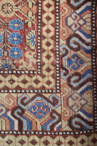 A Late 18th Century Herati Pattern Khotan rug. Khotan Carpet East Turkestan, circa 1900 The terracotta field with a lattice of flowering angular vines enclosed by borders of hooked and scrolled devices  ...