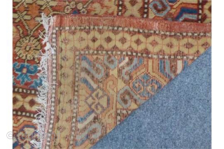 A Late 18th Century Herati Pattern Khotan rug. Khotan Carpet East Turkestan, circa 1900 The terracotta field with a lattice of flowering angular vines enclosed by borders of hooked and scrolled devices  ...