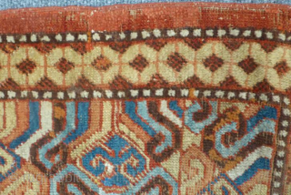 A Late 18th Century Herati Pattern Khotan rug. Khotan Carpet East Turkestan, circa 1900 The terracotta field with a lattice of flowering angular vines enclosed by borders of hooked and scrolled devices  ...