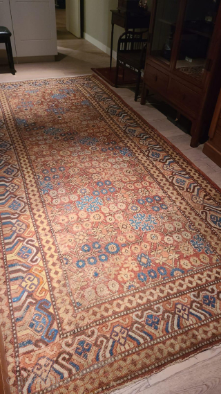 A Late 18th Century Herati Pattern Khotan rug. Khotan Carpet East Turkestan, circa 1900 The terracotta field with a lattice of flowering angular vines enclosed by borders of hooked and scrolled devices  ...