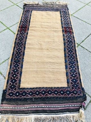 A nice Camel ground Baluch about 80-90 years old,the border is rug and the middle is Kelim.in a very good condition.            