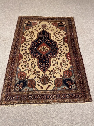 An Antique Farahan-Persian about 100 years,very nice naturall colrs,over all good condition,a very small repair in the corner. size:194x130 cm             