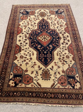 An Antique Farahan-Persian about 100 years,very nice naturall colrs,over all good condition,a very small repair in the corner. size:194x130 cm             