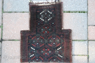 A 1'2"x1'4" Baluch saltbag Ca.1900, rare pile on two sides, corroded  blacks in the field.                 