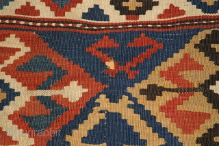 A 6'2"x8'2" Antique caucasian Kilim, nice colors, good overall condition with a couple small holes.                  