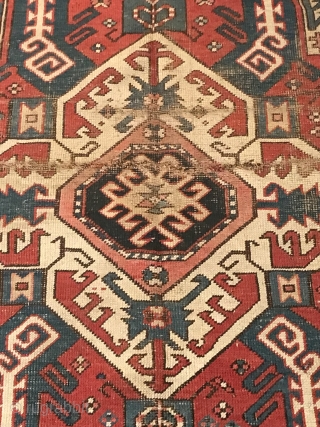 Antique Caucasian carpet  Kasim Ushak classic design presents well, creases in center medallion.
Measure 54” x 88”                