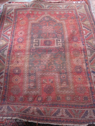 An antique Kazak prayer rug with the size 162 X 105 cm. Open sides, used parts. No repairs, no tinting, no cut. Good colors.         