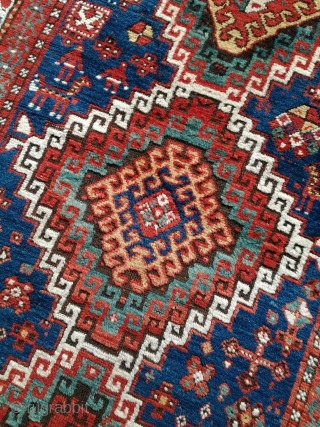 An antique Kazak rug. All natural dyes. 220/134 cm. Signs of use but good shape. All endings original. No repairs.             