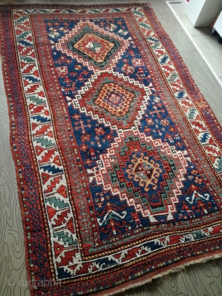 An antique Kazak rug. All natural dyes. 220/134 cm. Signs of use but good shape. All endings original. No repairs.             