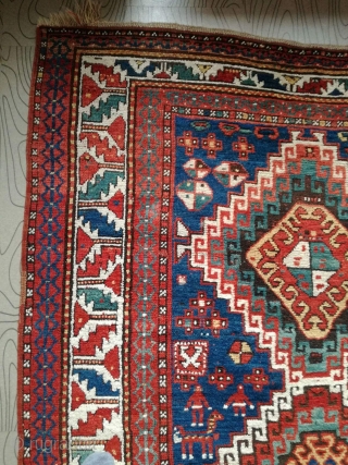 An antique Kazak rug. All natural dyes. 220/134 cm. Signs of use but good shape. All endings original. No repairs.             