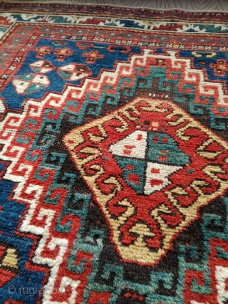 An antique Kazak rug. All natural dyes. 220/134 cm. Signs of use but good shape. All endings original. No repairs.             