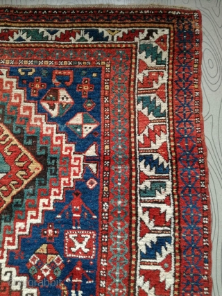 An antique Kazak rug. All natural dyes. 220/134 cm. Signs of use but good shape. All endings original. No repairs.             