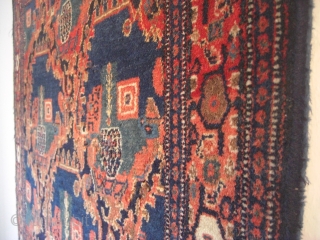 An old Senneh rug. Good shape but moth demages. 144 X 100 cm.                    