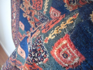 An old Senneh rug. Good shape but moth demages. 144 X 100 cm.                    