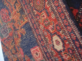 An old Senneh rug. Good shape but moth demages. 144 X 100 cm.                    