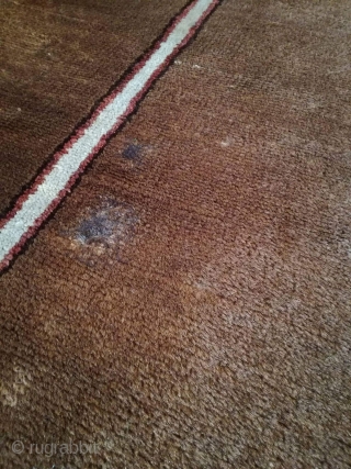 An antique camel hair ground NW Persian runner with 430/108 cm in good condition. Two spots repiled. One side with kilim ending, the other open. On wool rug.     