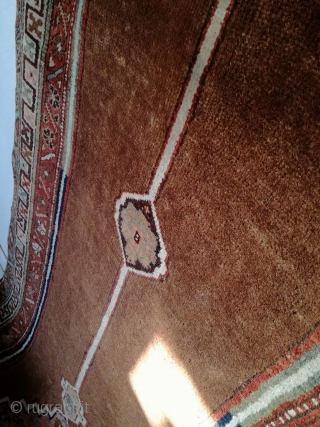 An antique camel hair ground NW Persian runner with 430/108 cm in good condition. Two spots repiled. One side with kilim ending, the other open. On wool rug.     