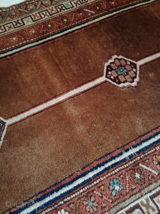 An antique camel hair ground NW Persian runner with 430/108 cm in good condition. Two spots repiled. One side with kilim ending, the other open. On wool rug.     