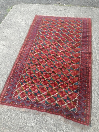 An antique Turkmen rug with 190/115 cm. Good shape with spot worn places.                    