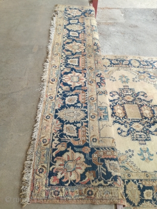 An antique Tabriz or NW Persian carpet with 397/296 cm. As found condition with moth demages and open side.              