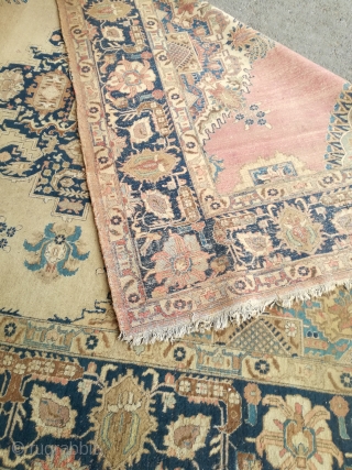 An antique Tabriz or NW Persian carpet with 397/296 cm. As found condition with moth demages and open side.              