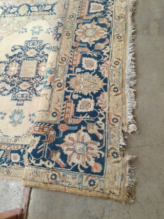 An antique Tabriz or NW Persian carpet with 397/296 cm. As found condition with moth demages and open side.              