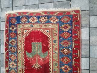 An antique Anatolian rug with 170/110 cm. Repiles and demages. Rare design.                     