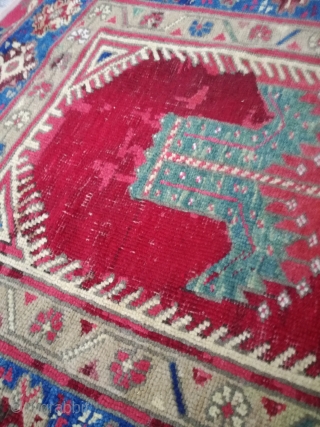 An antique Anatolian rug with 170/110 cm. Repiles and demages. Rare design.                     