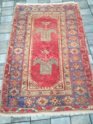 An antique Anatolian rug with 170/110 cm. Repiles and demages. Rare design.                     