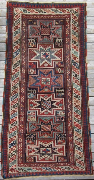 Late 19th c. Gendje, 3'8" x 9'1".  A very attractive long rug featuring lovely stars and animals in very good condition.           